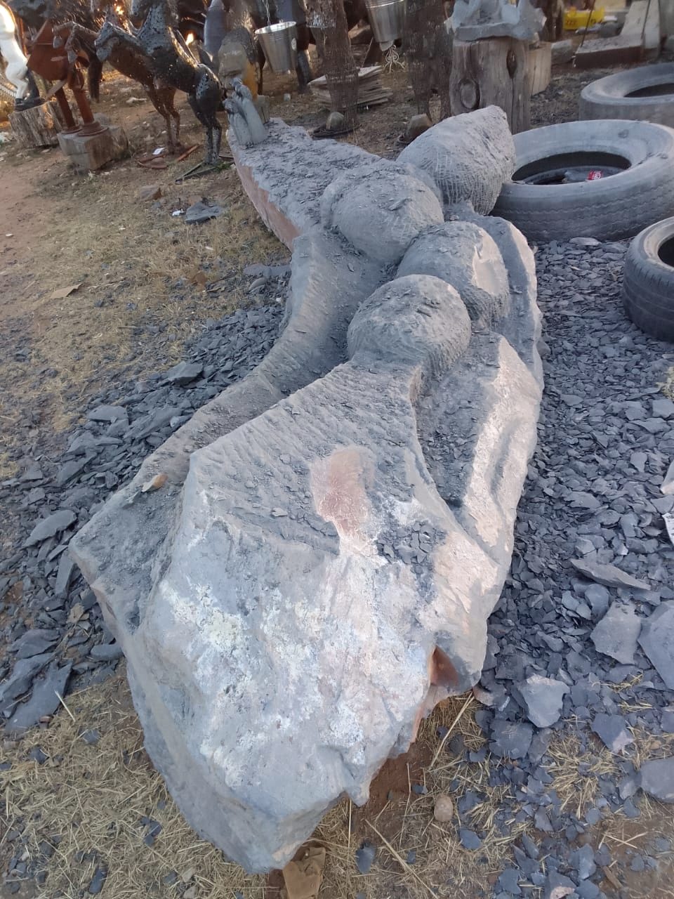 The carving seen along its length, with figures now separated from the surrounding stone