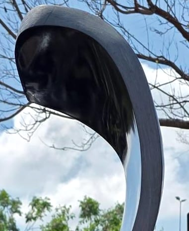 The polished curl at the top of the ribbon
