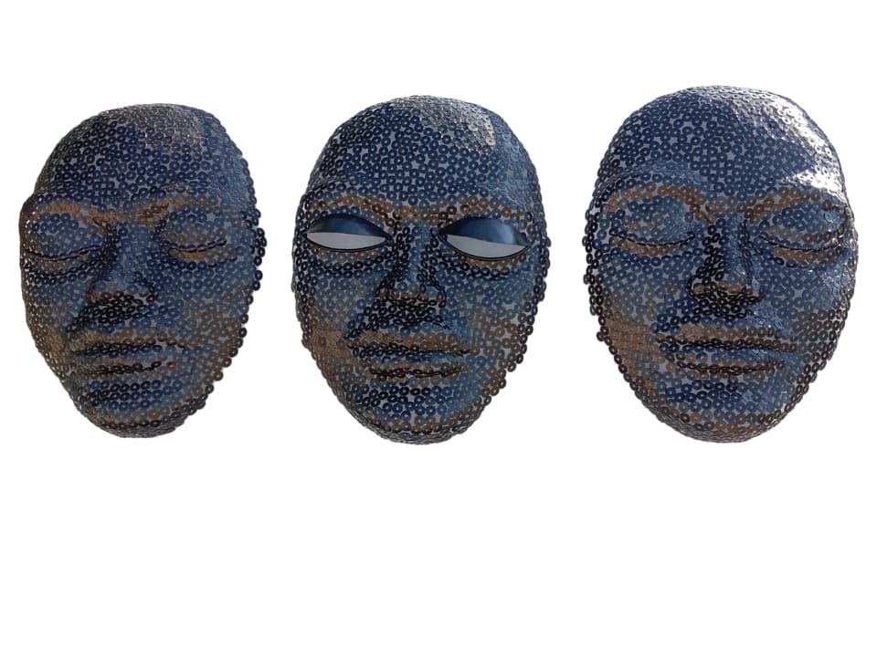 Three washer-built faces side by side, on white