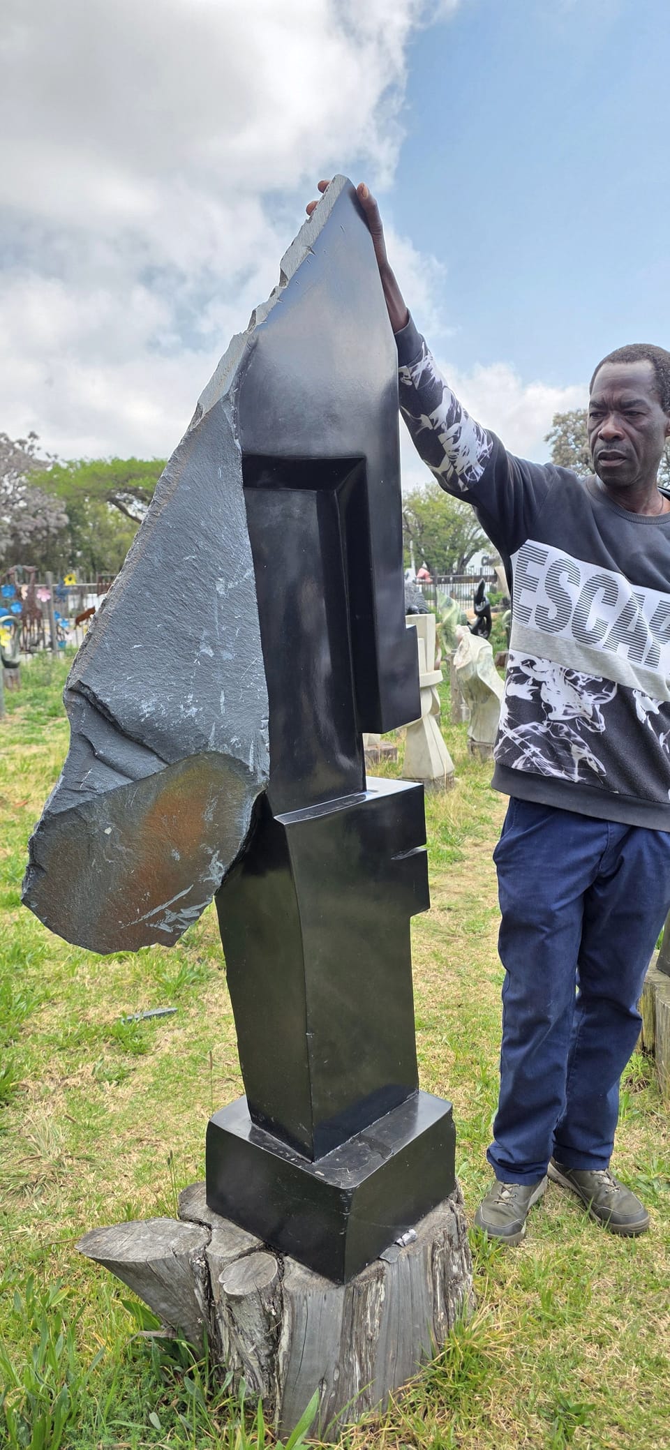 Nomore with his hand on the veiled head