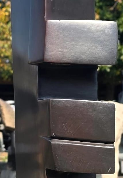 Stepped blocks forming the profile, polished to a soft sheen