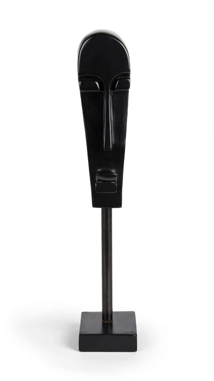 Long narrow polished stone face raised on a slim stem and square base, on white